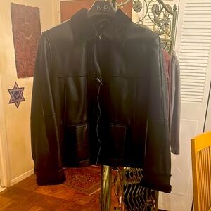 Black Leather Jacket with lamb lining and collar.
